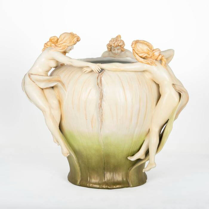 A bowl with women holding hands and dancing around the bowl. The farther down the bowl the color gets greener and darker.